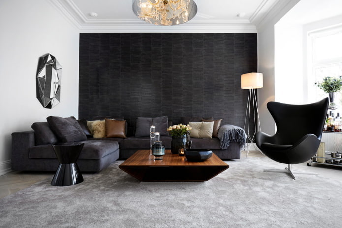 divano angolare con rivestimento in tessuto grigio e nero