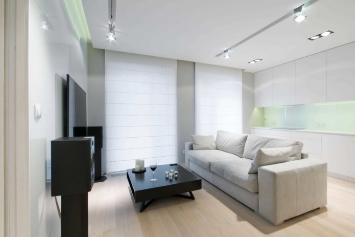 dekoras ir apšvietimas gyvenamajame kambaryje minimalistiniu stiliumi